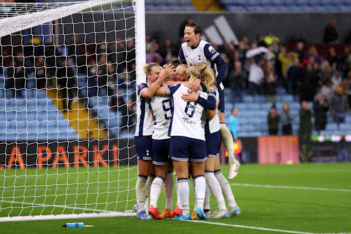 Bethany England celebrates with teammates