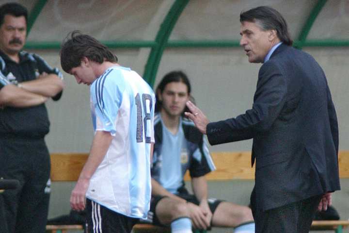 Argentine's Lionel Messi (C) is comforte