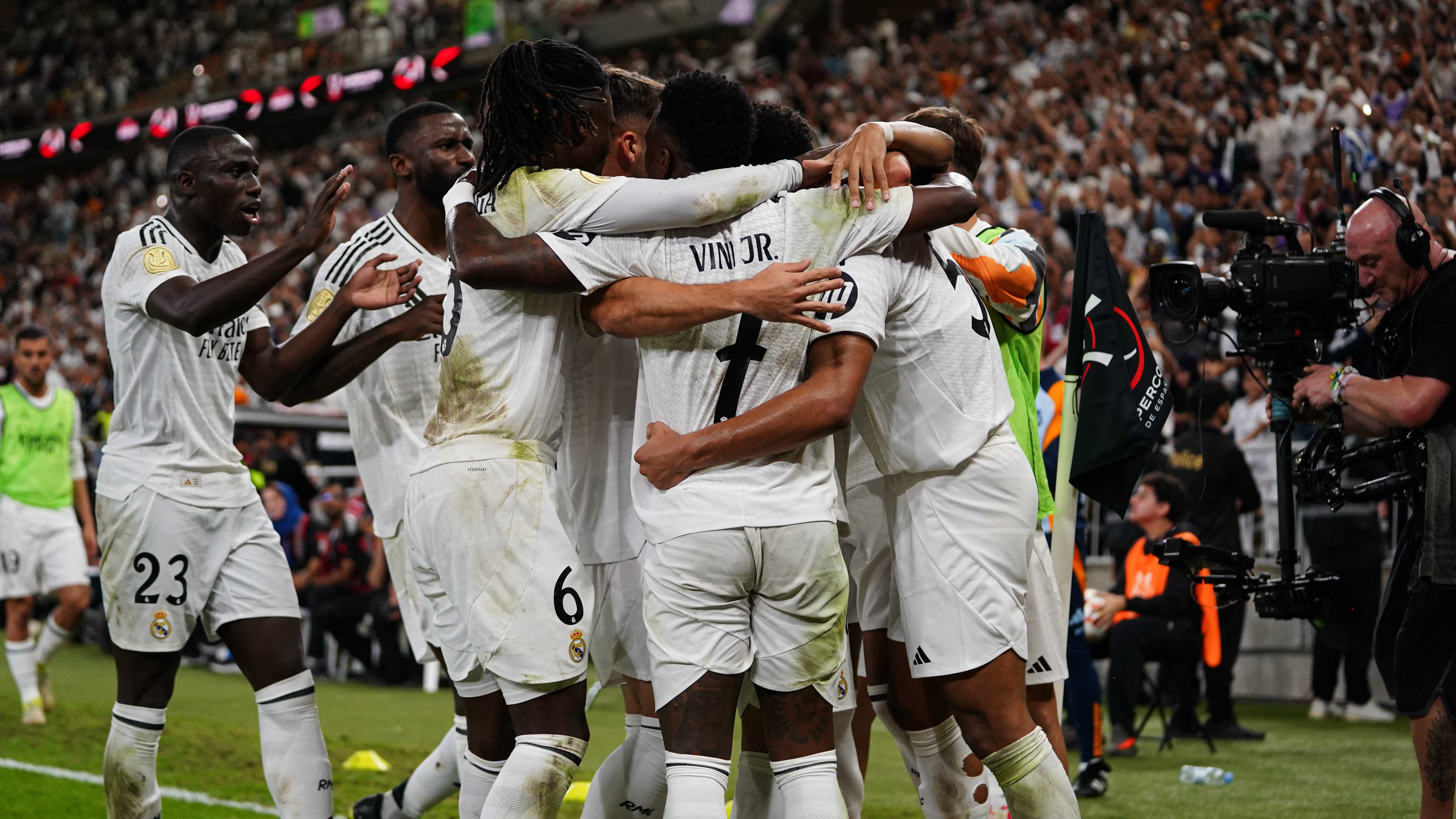 Real Madrid celebrate scoring their third goal against Mallorca in the Super Cu