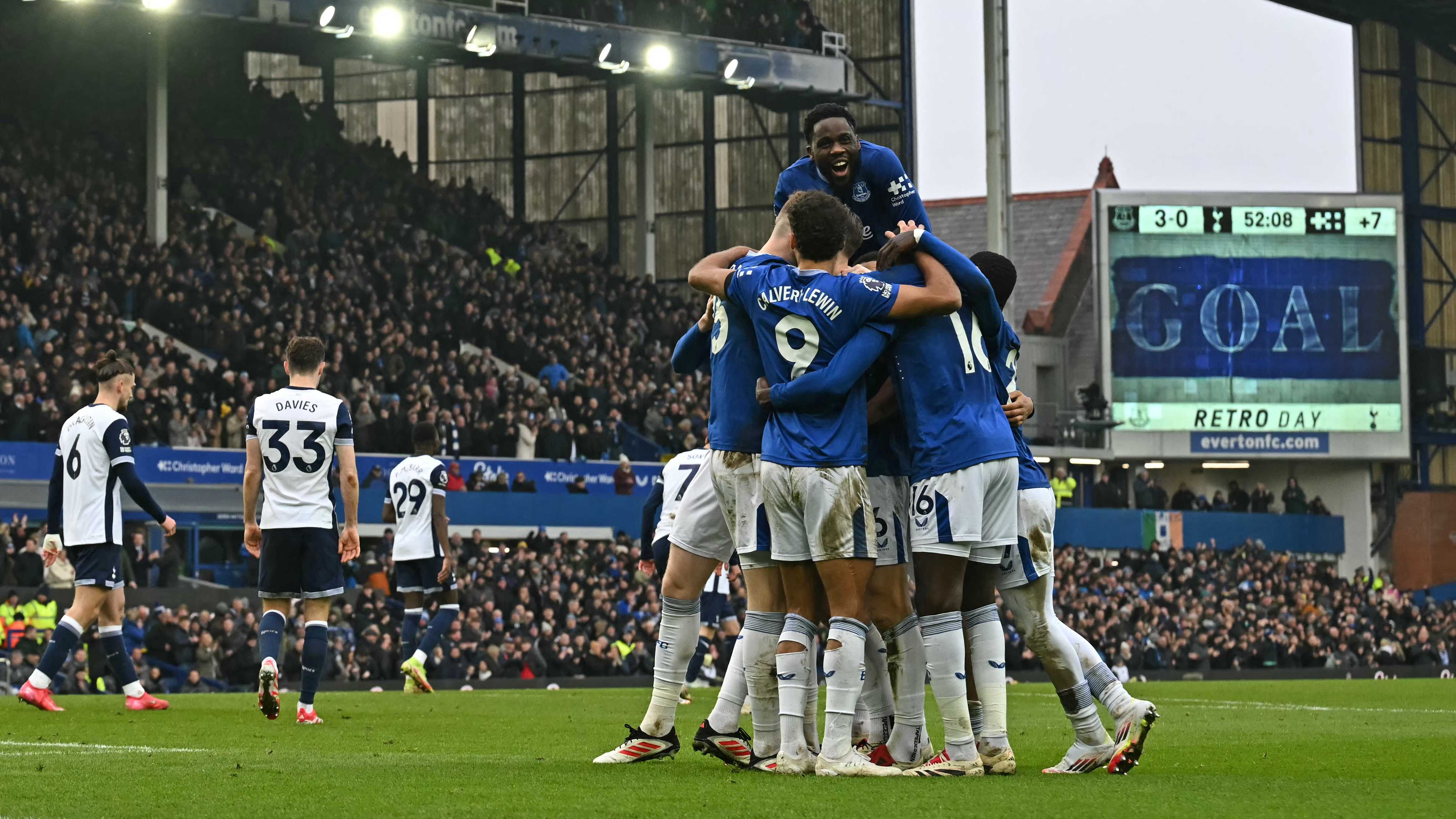 Everton's players celebrate their third goal against Tottenha