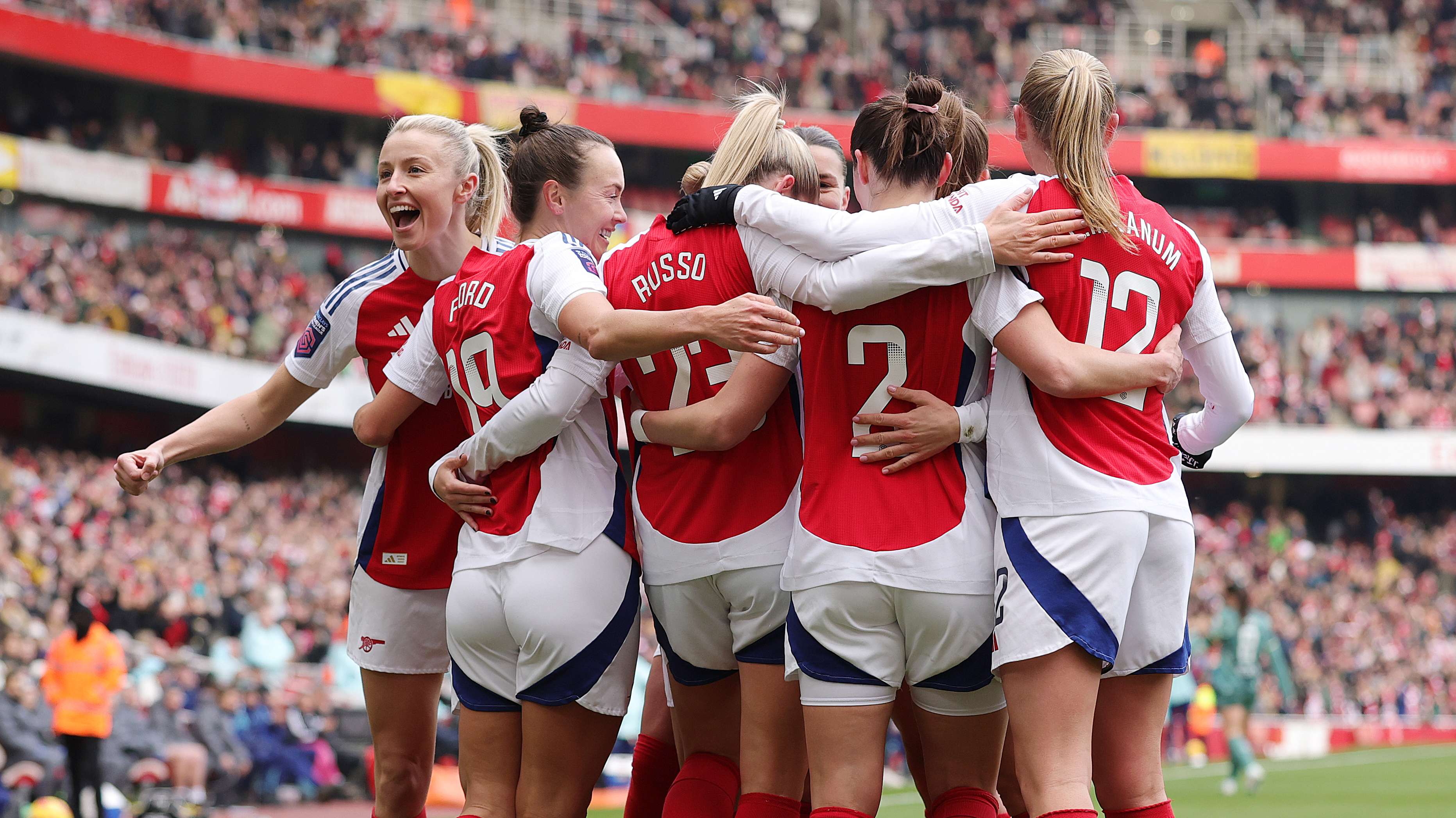 Arsenal celebrate scoring against Tottenham in the north London derb